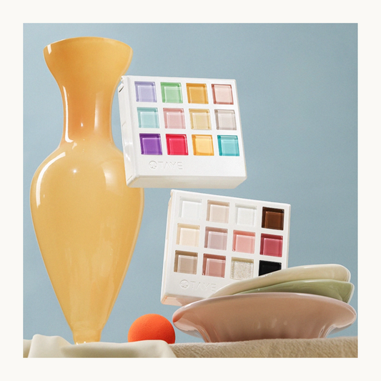 Two TAYE gel cube palettes displayed with soft pastel colors, showing professional nail art color options.