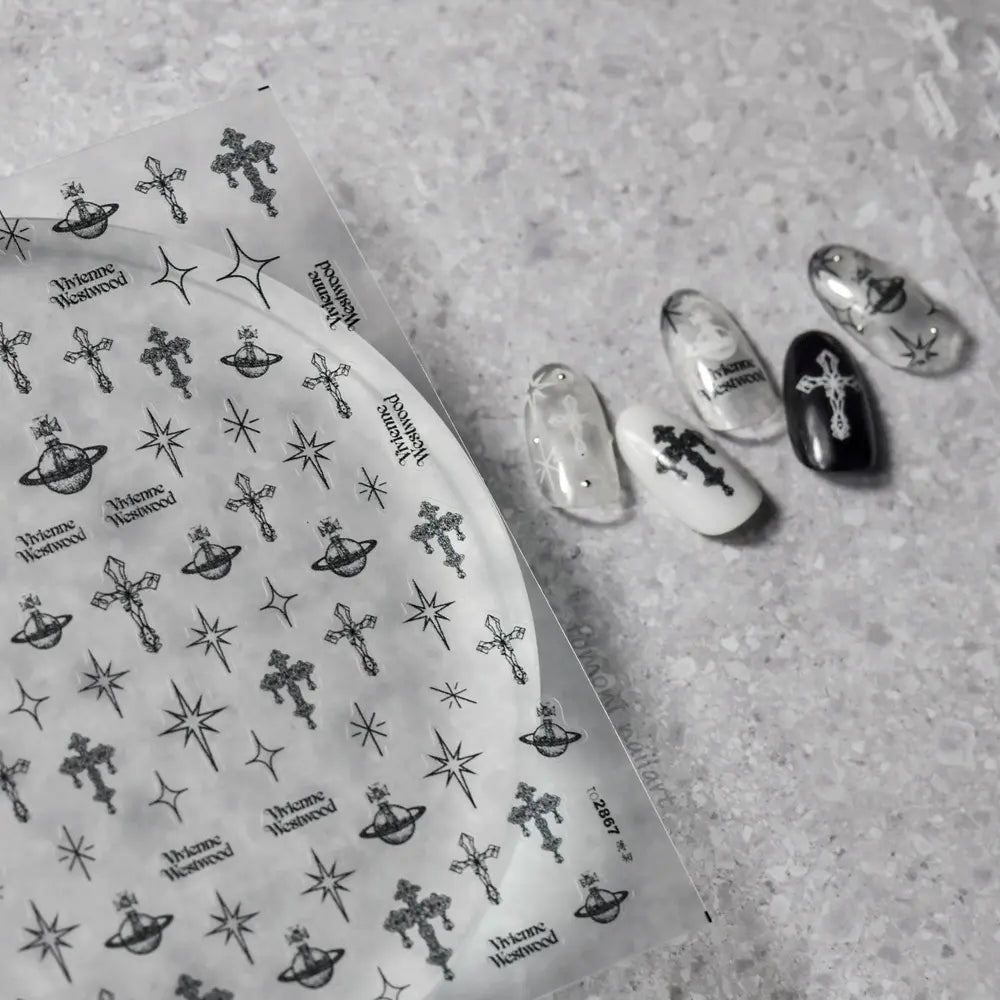 Black celestial cross nail stickers from tomoni 2867 on nail tips