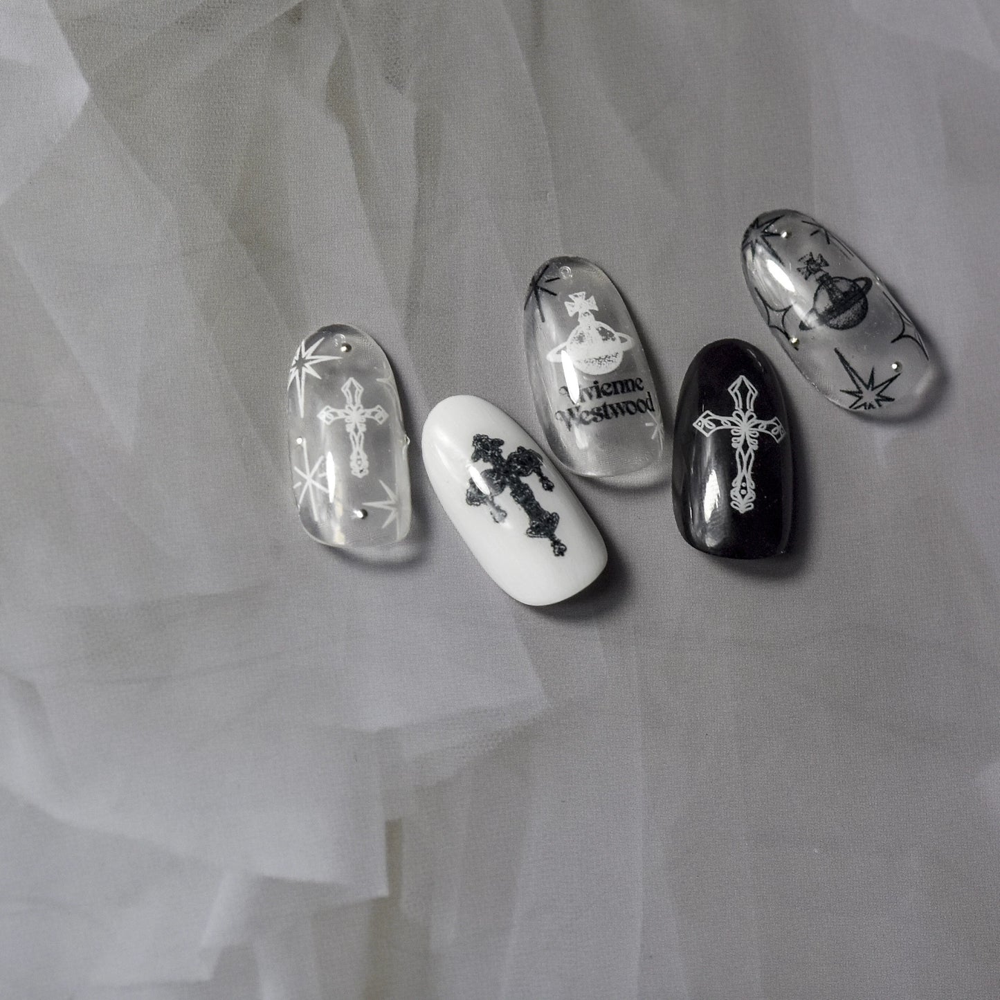 Black and white celestial cross nail art stickers on monochrome nails
