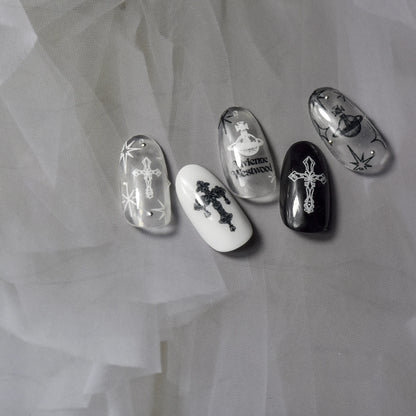 Black and white celestial cross nail art stickers on monochrome nails