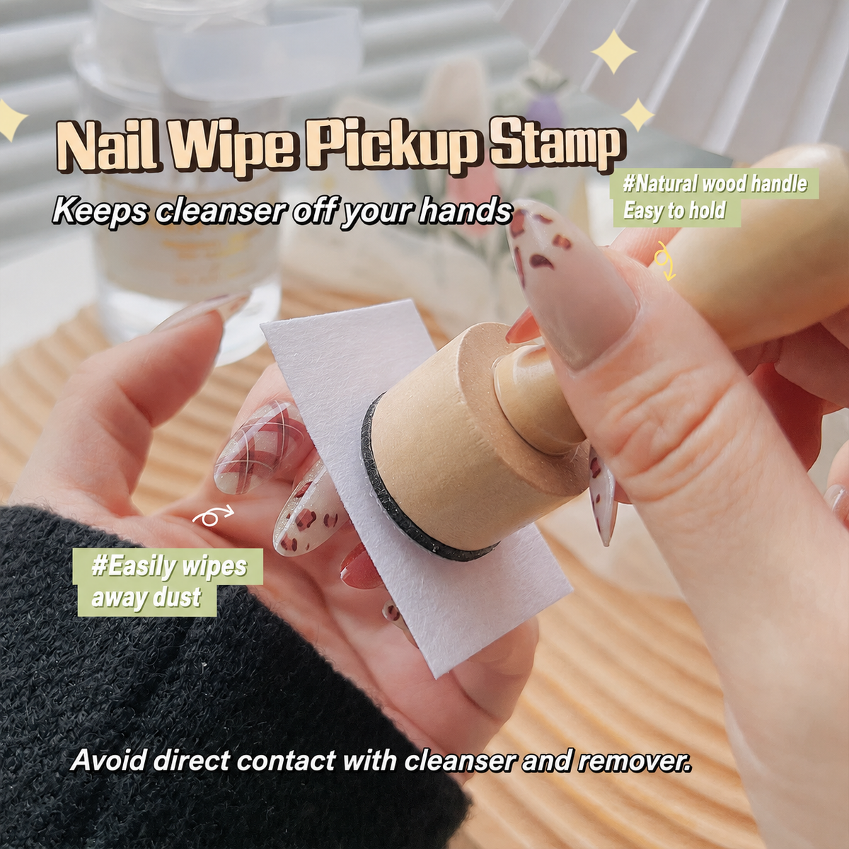 Wooden nail wipe pickup stamp holding a nail wipe