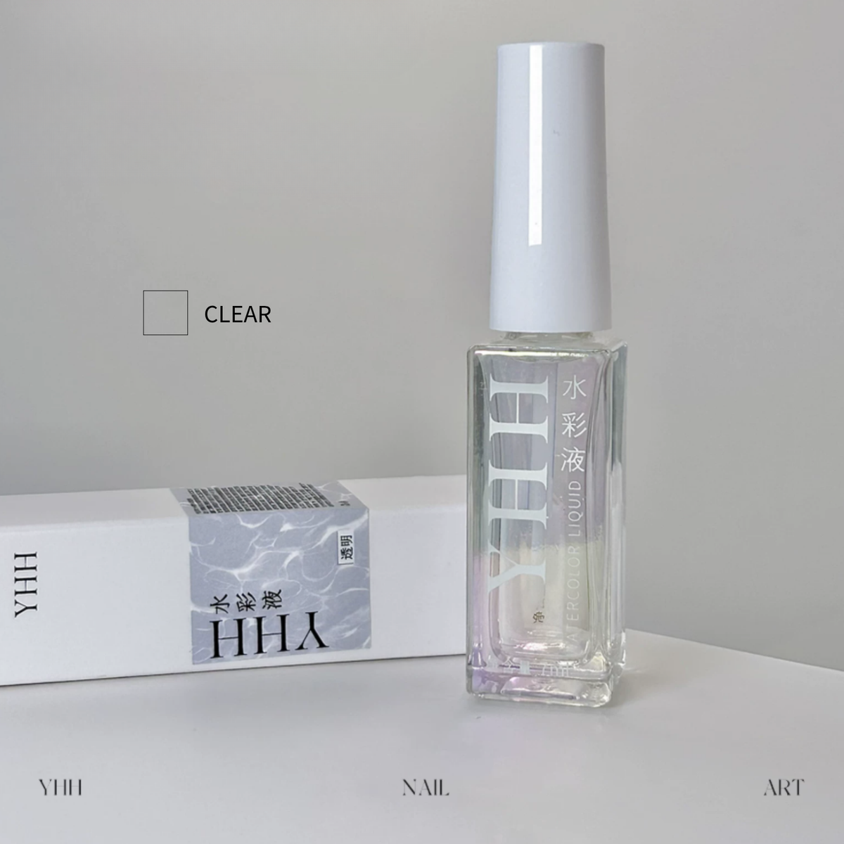 YHH Clear Watercolor Liquid for nail art, featuring a transparent liquid formula in a clear bottle with a white cap and matching product packaging.