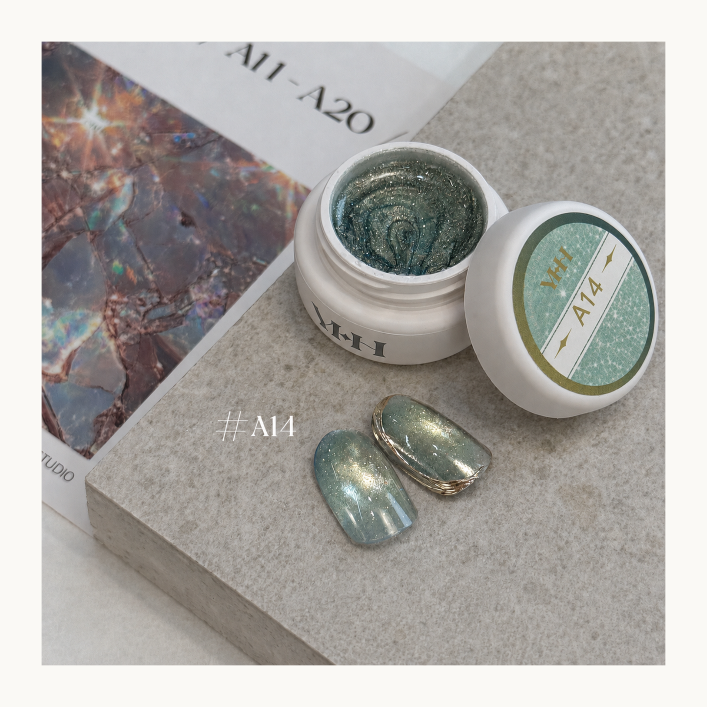 YHH Ethereal Glow A14 sage green magnetic cat eye gel with fine golden shimmer and a luminous dimensional effect.