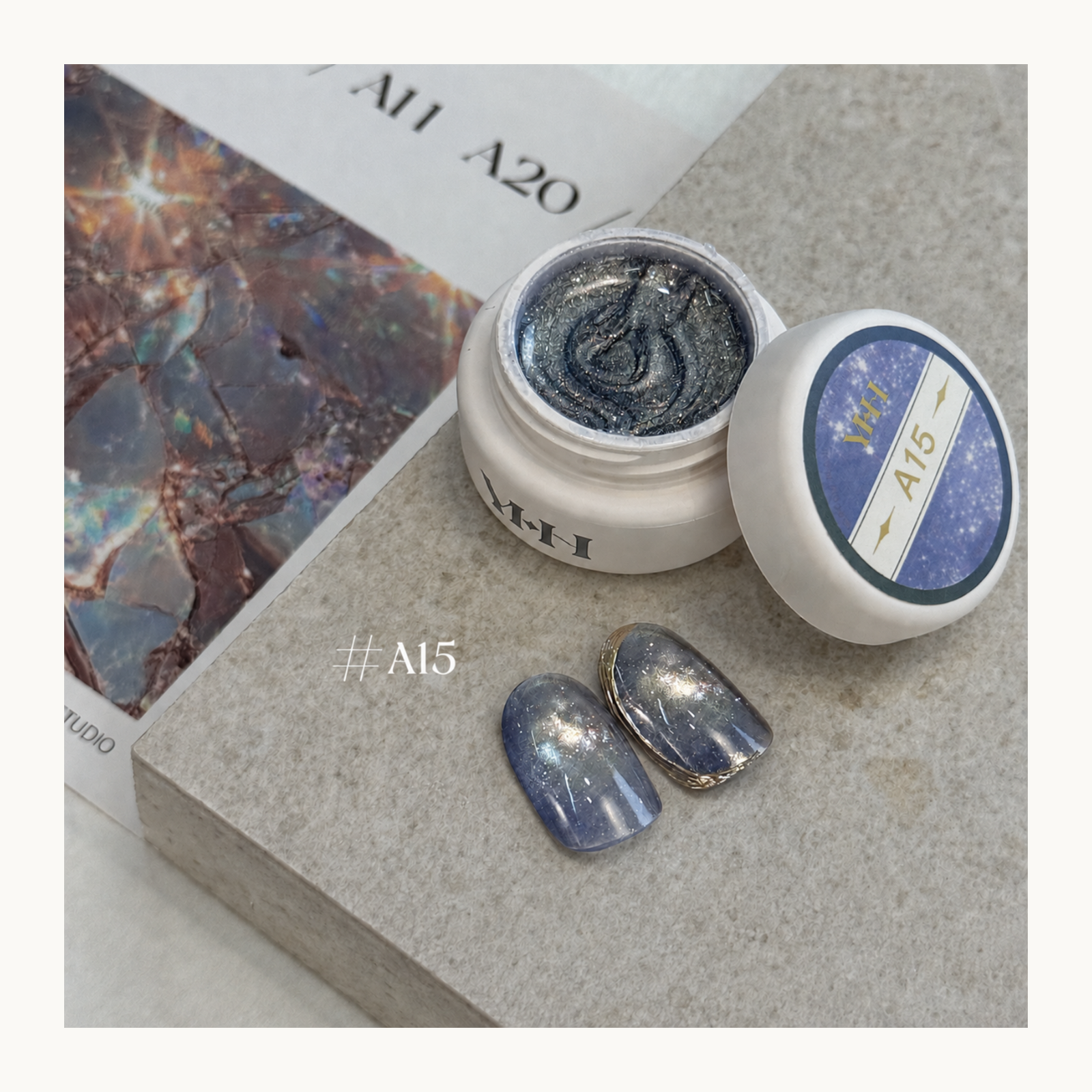 YHH Ethereal Glow A15 smoky blue magnetic cat eye gel with fine silver shimmer and a luminous glass-like finish.