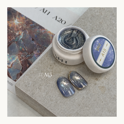 YHH Ethereal Glow A15 smoky blue magnetic cat eye gel with fine silver shimmer and a luminous glass-like finish.