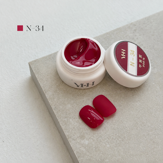 Vivid red gel nail color jar with two red swatches