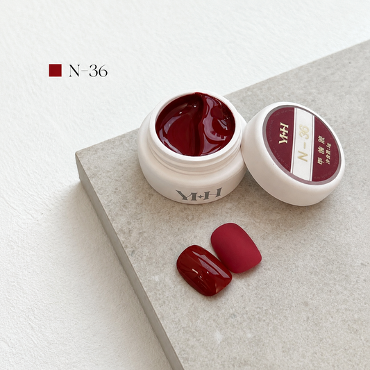 Deep crimson gel nail color jar with two red swatches