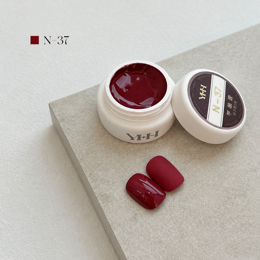 Dark wine-red gel nail color jar with two burgundy swatches
