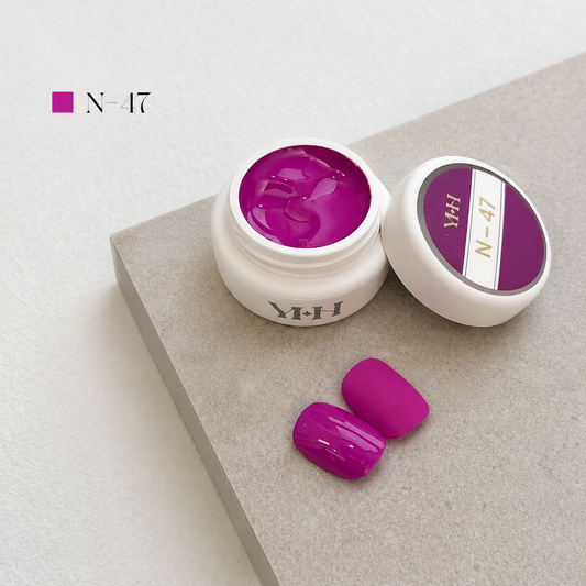 Vivid fuchsia gel nail color jar with two pink swatches