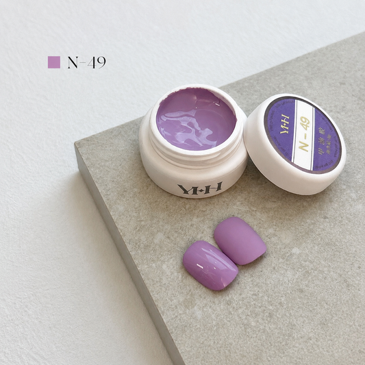 Lilac-mauve gel nail color jar with two pale purple swatches