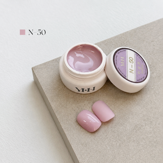 Milky nude-pink gel nail color jar with two pale pink swatches