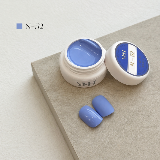 Dusty periwinkle-blue gel nail color jar with two blue swatches
