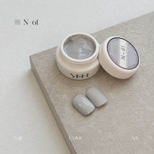Soft greige gel nail color jar with two pale gray swatches