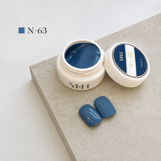 Slate-blue gel nail color jar with two blue-gray swatches