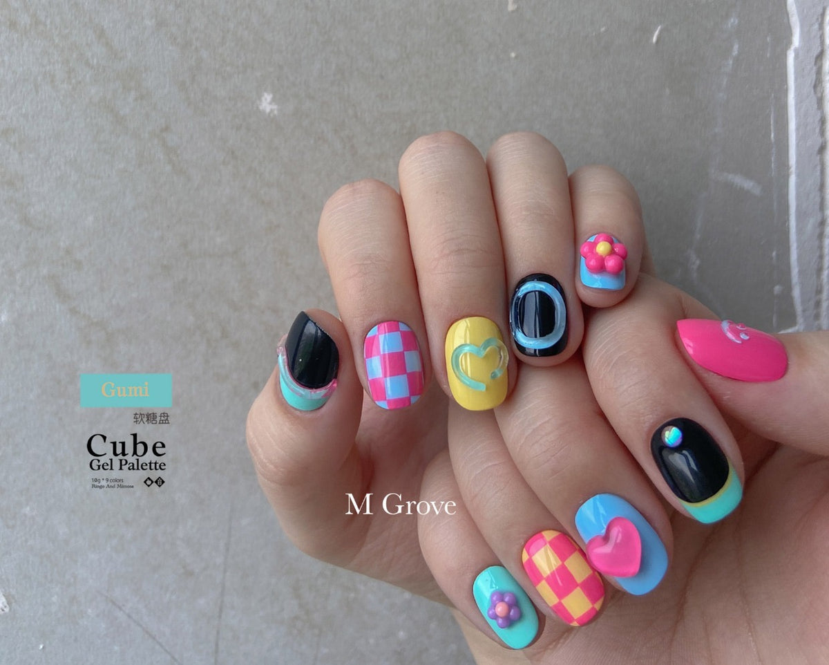 Gumi soft gel palette manicure with colorful checkerboard and heart nails