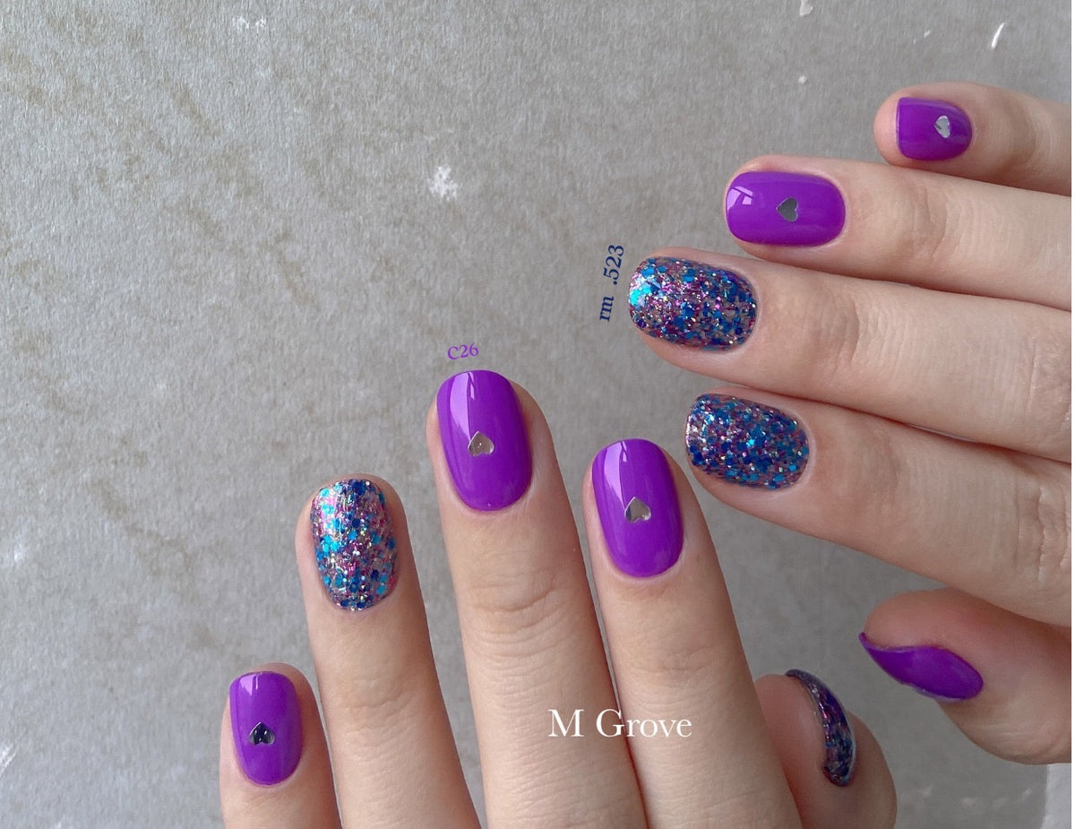 Gumi soft gel palette manicure with glossy purple and glitter accent nails