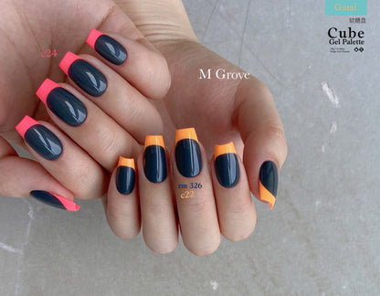 Gumi soft gel palette manicure with navy nails and neon orange tips