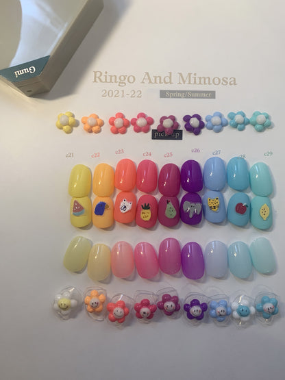 Gumi soft gel palette shade chart with warm-to-cool glossy swatches and flowers