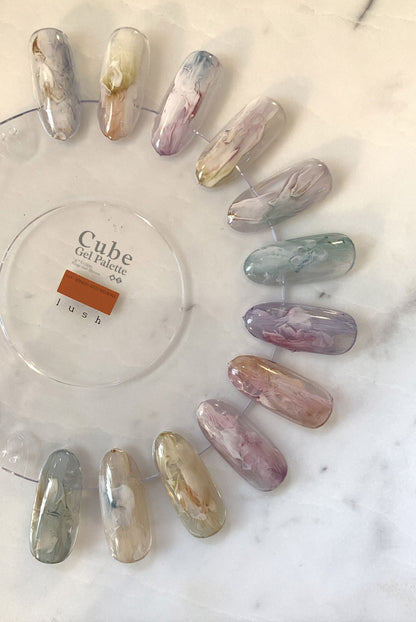 Nine-color soft gel palette showing translucent marbled swatches