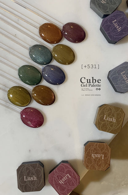 Soft gel color swatches on clear sticks with surrounding palette pans