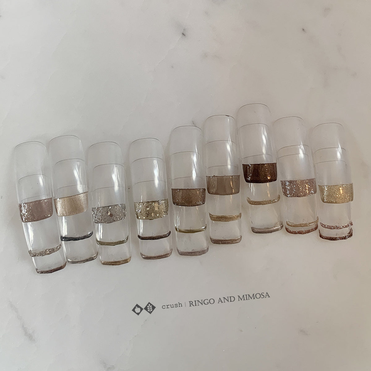 Gel palette shade chart with neutral metallic and glitter nail tips