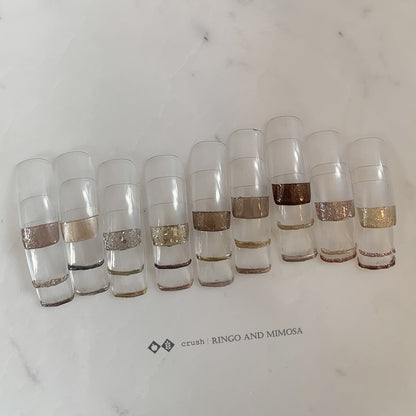 Gel palette shade chart with neutral metallic and glitter nail tips