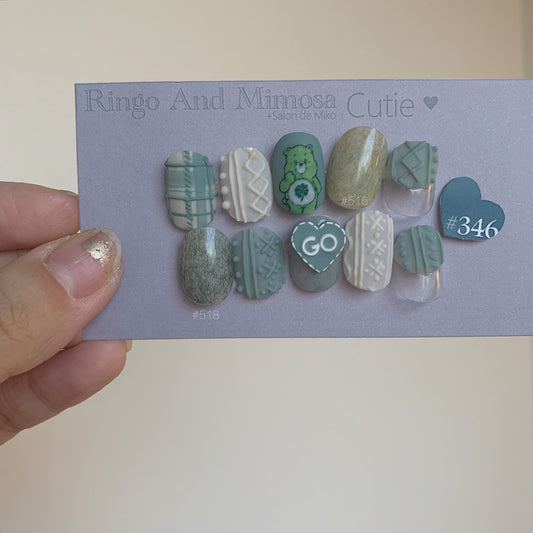 Rily Cute Bear nail art sticker detail with teal, white, and textured pastel tips
