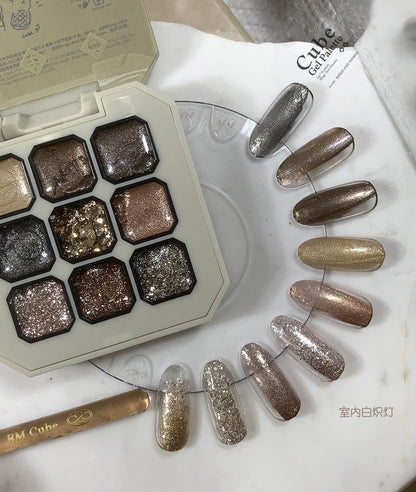 Nine-shade gel palette with silver, bronze, and rose-gold swatches