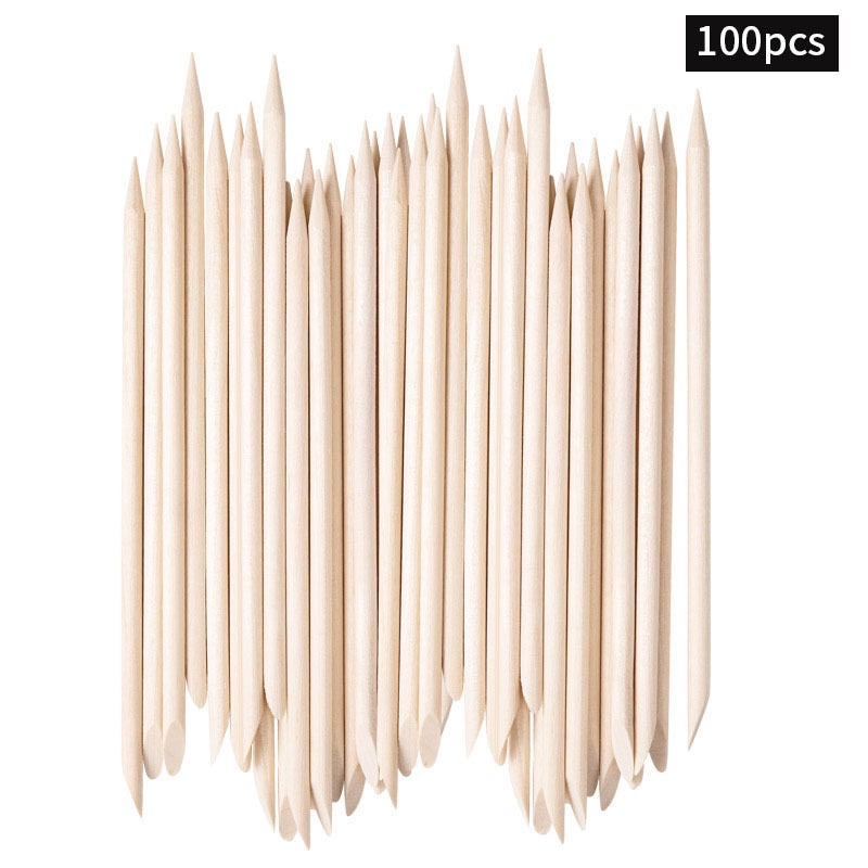 Double-ended pointed wooden nail art sticks aligned with both ends visible