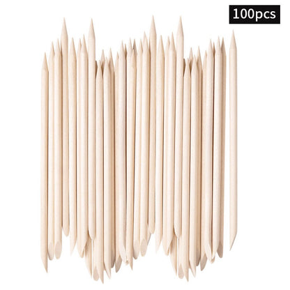 Double-ended pointed wooden nail art sticks aligned with both ends visible