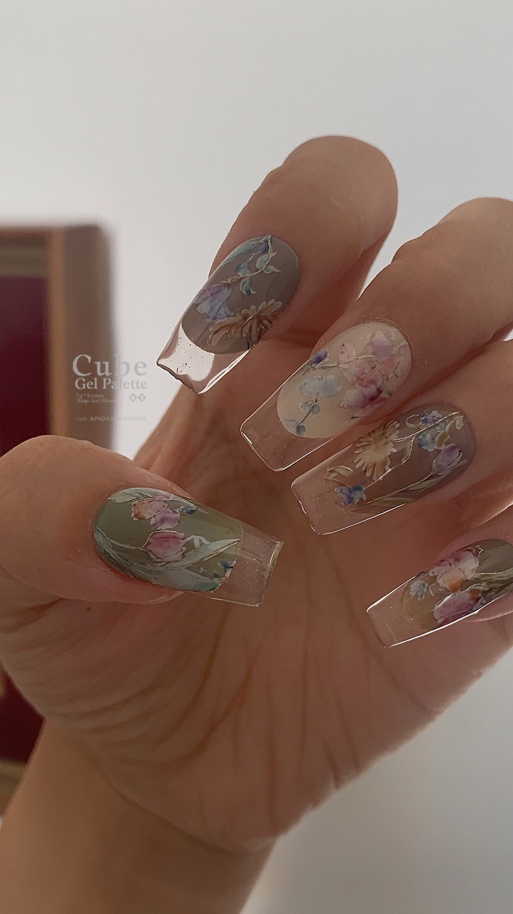Floral soft gel manicure displayed on a hand