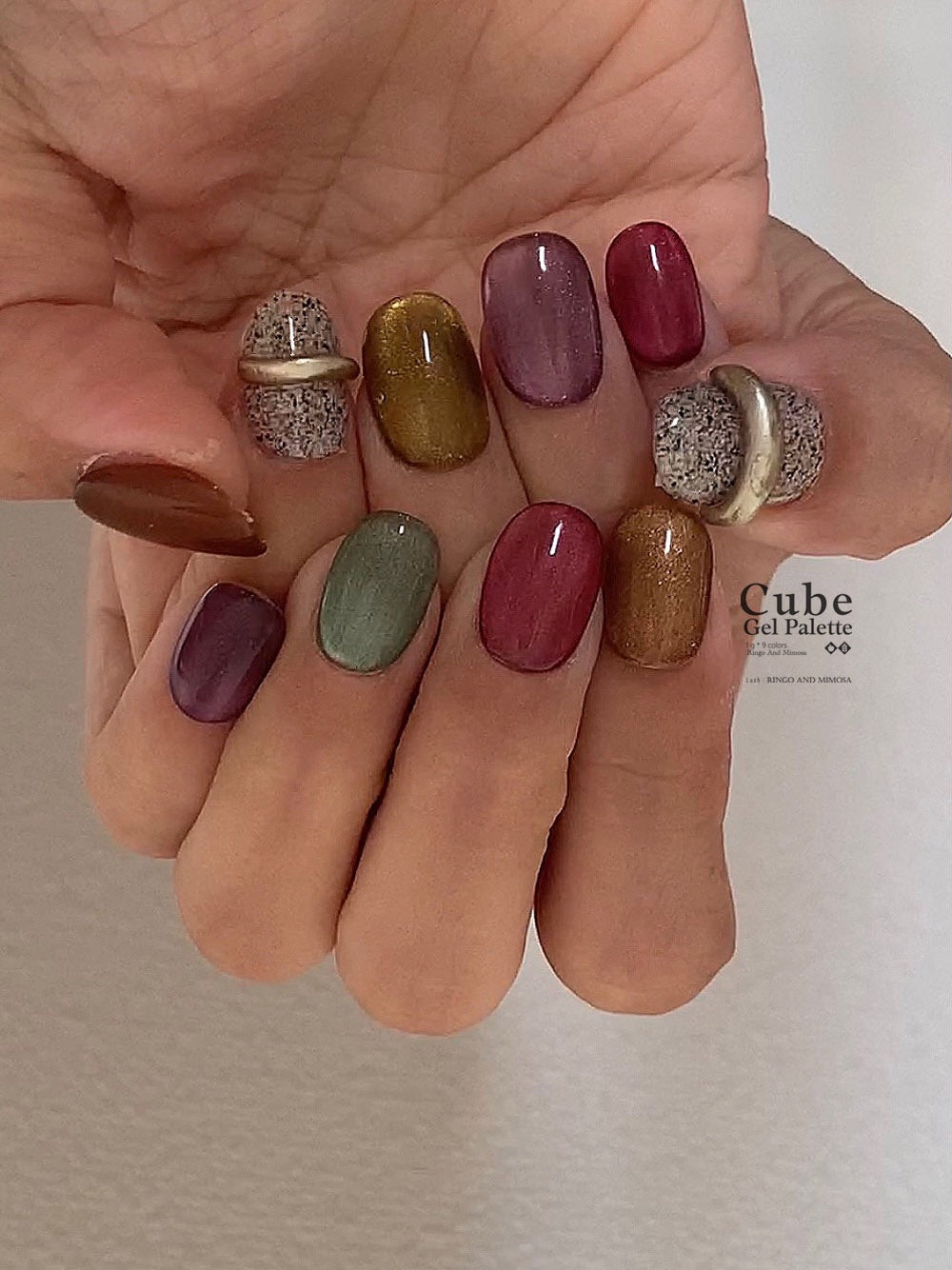 Multicolor soft gel manicure with brown, olive, mauve, and burgundy nails