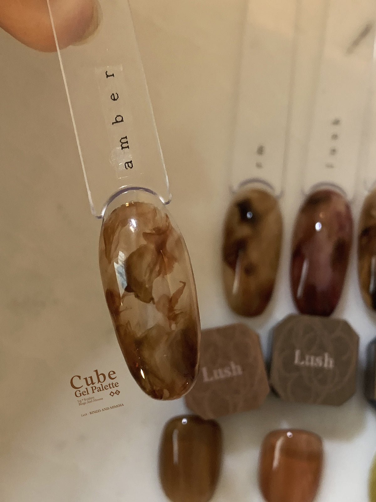 Close-up of brown marbled soft gel swatch with labeled pieces