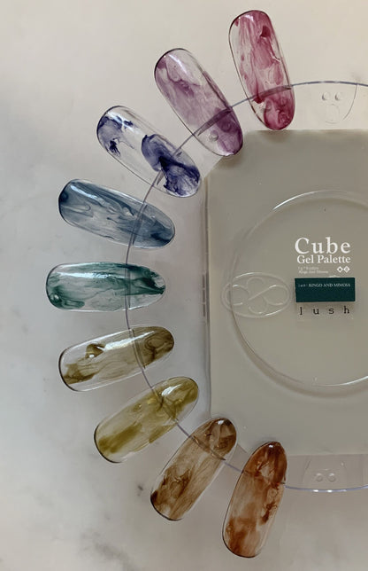 Nine-color soft gel palette on a clear swatch ring