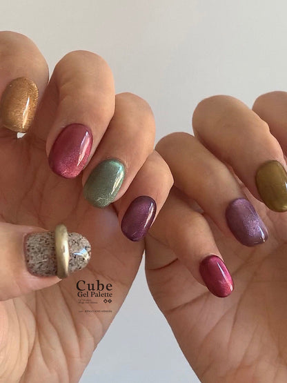 Multicolor soft gel manicure displayed on overlapping hands
