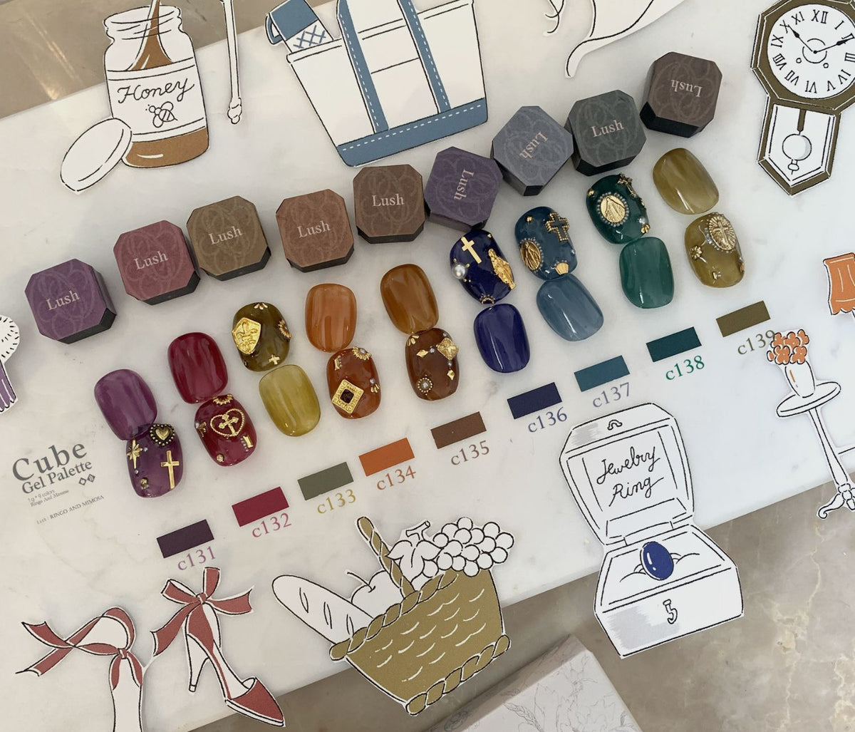Nine-shade Ringo & Mimosa soft gel palette chart with nail art swatches