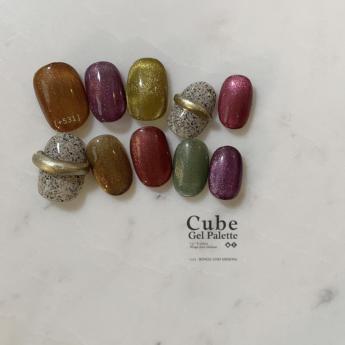 Ten soft gel color swatches with two speckled ring-like accents