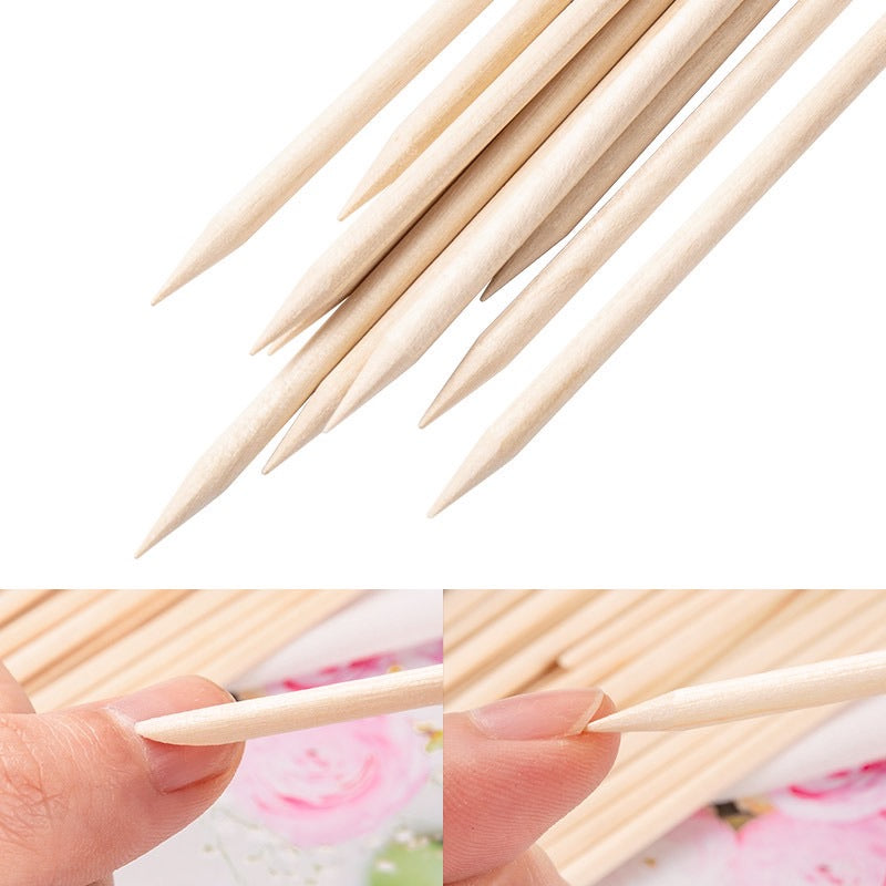 Pointed wooden nail art stick shown with decorated nail examples