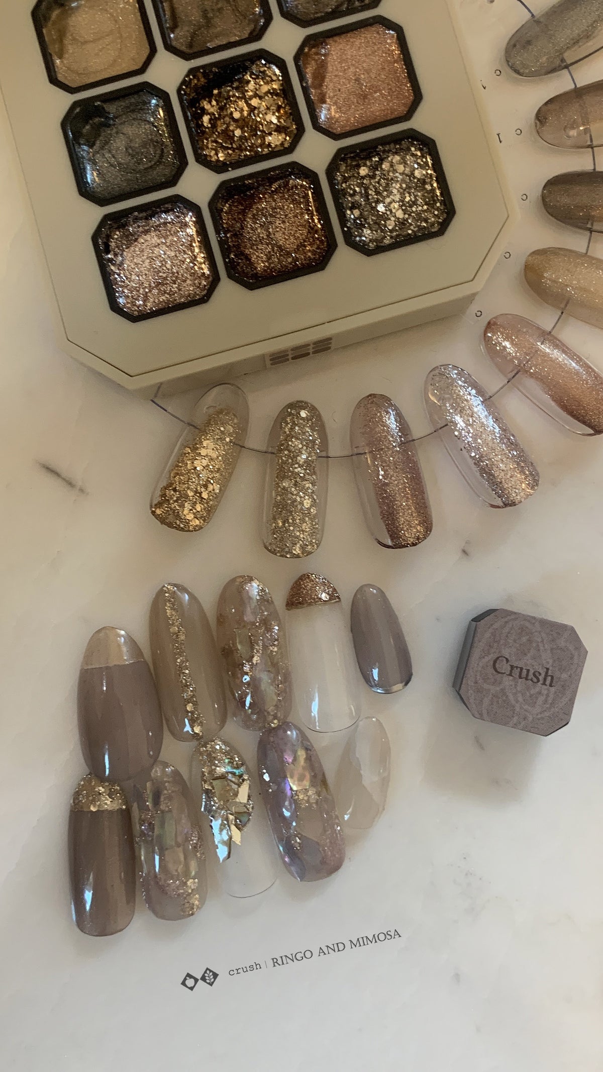 Gel palette with coordinated gold, silver, and neutral nail tips
