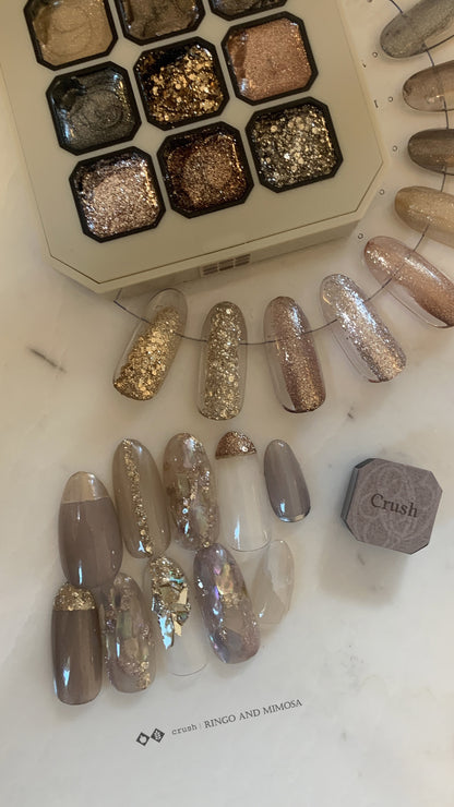Gel palette with coordinated gold, silver, and neutral nail tips