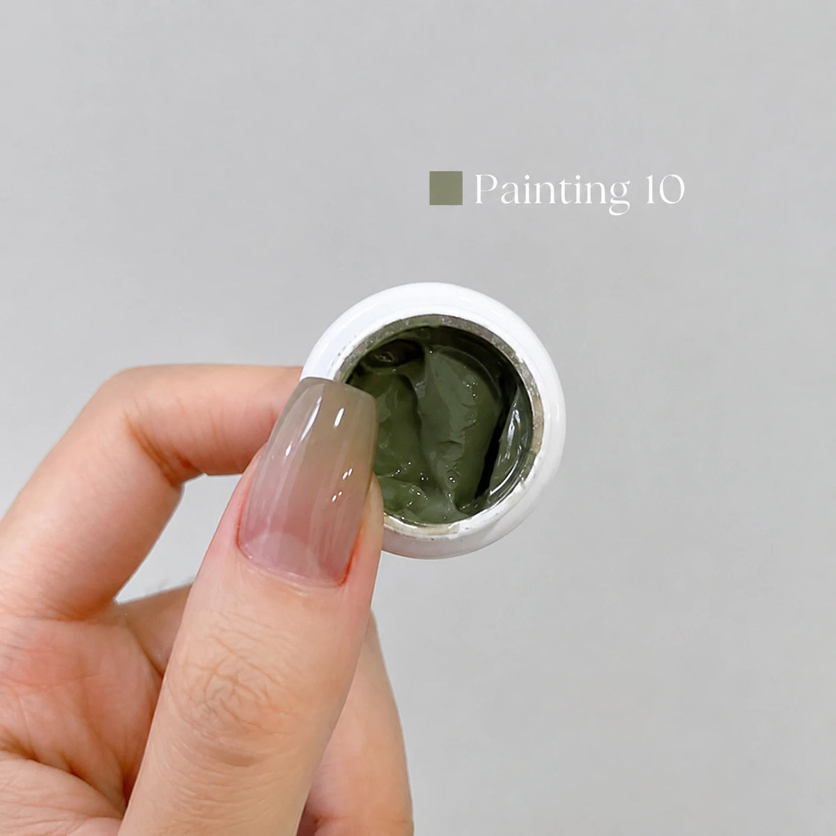 YHH Patting Painting Chrome-Rubbable Pot Gel 5g, shade P10 – muted olive-green gel in an open pot beside a painted nail.